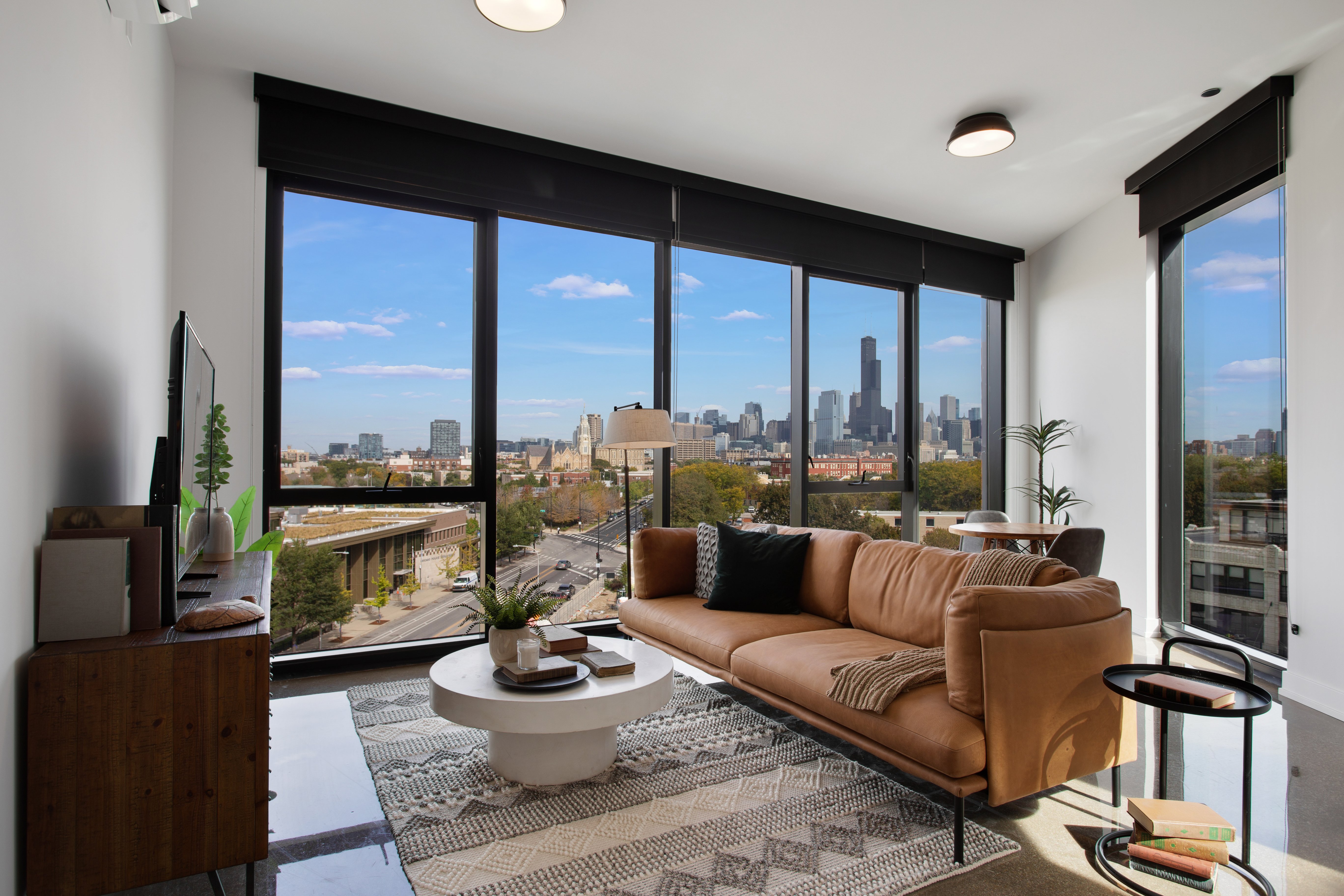 Interior photograph of apartment living room with skyline view