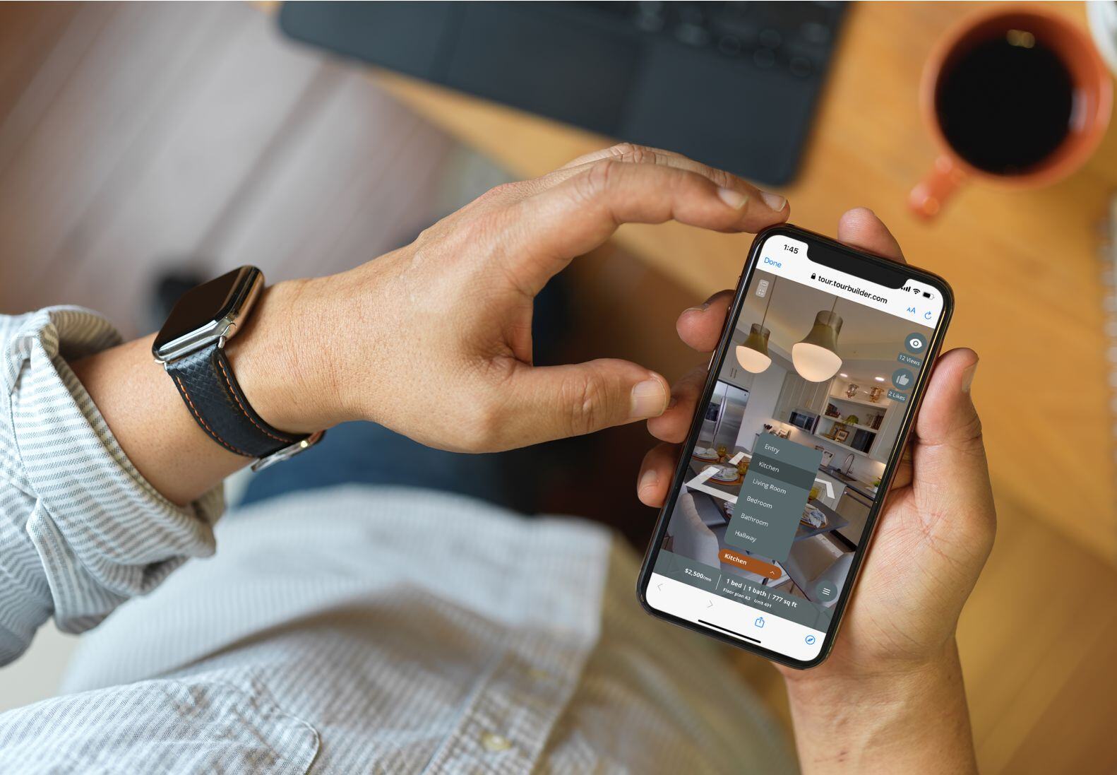 Picture of man holding a cell phone viewing a unit-level virtual tour