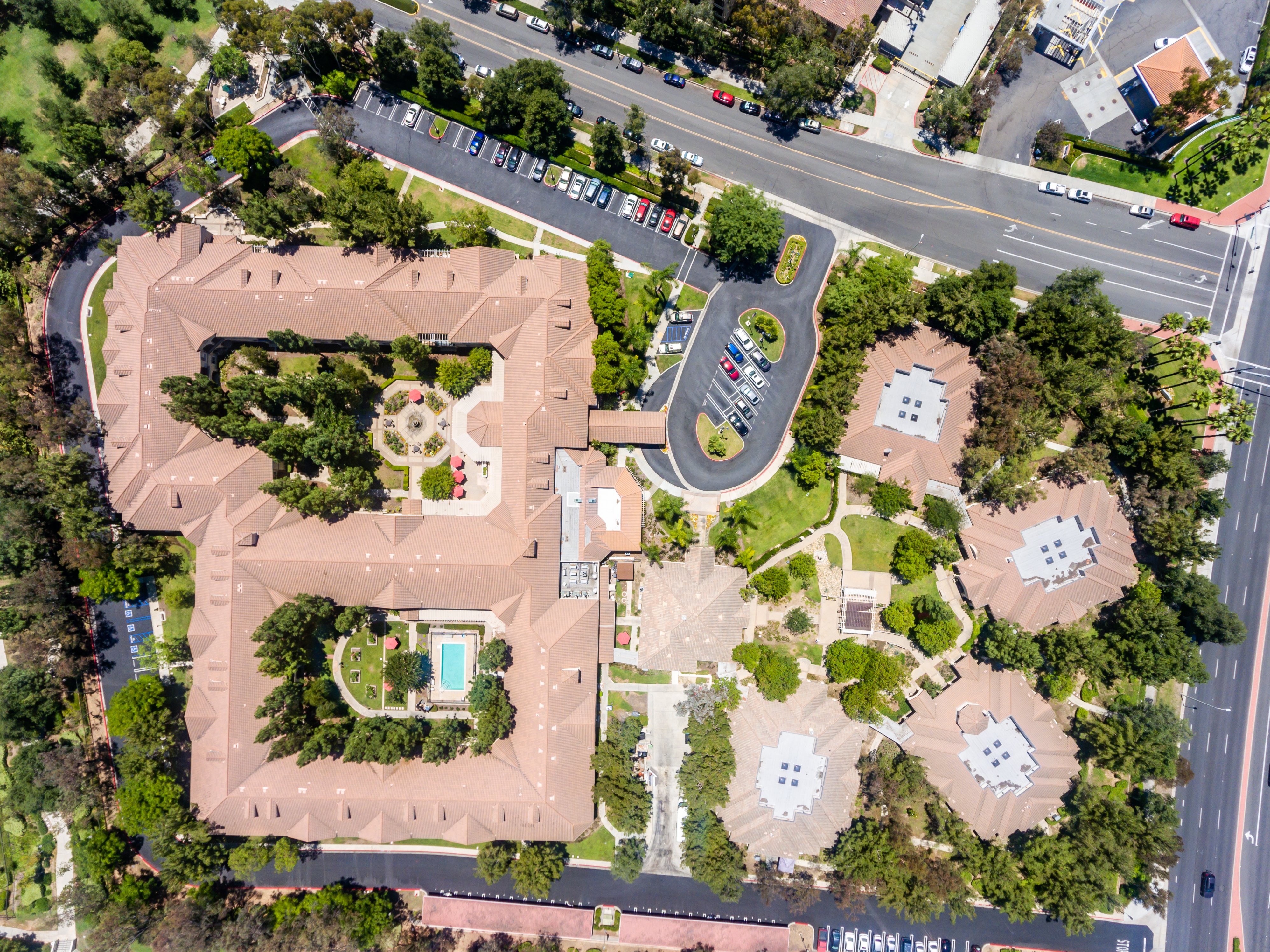 Top view exterior drone photograph of an apartment community